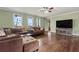 Bright living room with hardwood floors, large windows, and ample seating at 2002 Wingate Rd, Atlanta, GA 30341