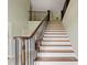Inviting staircase with wood and wrought iron railing detail at 2002 Wingate Rd, Atlanta, GA 30341