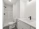 Clean bathroom featuring a sleek vanity with undermount sink and modern shower stall at 2626 Shadow Woods Ne Cir, Marietta, GA 30062