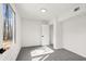 A bright bedroom with a large window, closet, and neutral gray carpeting at 2626 Shadow Woods Ne Cir, Marietta, GA 30062