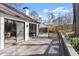 Large wooden deck with railing that extends from sliding glass doors to a backyard at 2626 Shadow Woods Ne Cir, Marietta, GA 30062