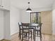 Cozy dining area featuring modern lighting and a window view to the outside at 2626 Shadow Woods Ne Cir, Marietta, GA 30062