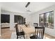 Dining area featuring modern lighting and a view to the living room at 2626 Shadow Woods Ne Cir, Marietta, GA 30062