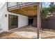 A view of the home's covered outdoor patio and landscaping at 2626 Shadow Woods Ne Cir, Marietta, GA 30062