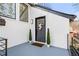Charming front porch with a decorative door, planters, and modern railing at 2626 Shadow Woods Ne Cir, Marietta, GA 30062