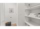 Bright laundry area with shelves and storage space at 2626 Shadow Woods Ne Cir, Marietta, GA 30062