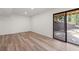 A bright living room with sliding glass doors to the exterior space with wood-look vinyl flooring at 2626 Shadow Woods Ne Cir, Marietta, GA 30062