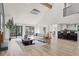 Open-concept living room with modern decor, fireplace, and large windows at 2626 Shadow Woods Ne Cir, Marietta, GA 30062