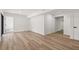 A spacious living room featuring clean white walls and sleek, light brown wood flooring at 2626 Shadow Woods Ne Cir, Marietta, GA 30062