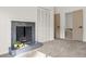 Cozy living room with a fireplace and light gray carpet with doors to the bathroom and closet at 2626 Shadow Woods Ne Cir, Marietta, GA 30062