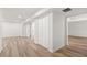 Spacious living room with wood look flooring and a closet at 2626 Shadow Woods Ne Cir, Marietta, GA 30062