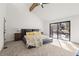Bright primary bedroom with vaulted ceiling and sliding glass doors to deck at 2626 Shadow Woods Ne Cir, Marietta, GA 30062