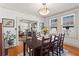 Dining room featuring hardwood floors, neutral colors, and access to the kitchen and living room at 2653 Brookwood Ne Dr, Atlanta, GA 30305