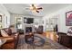 Comfortable living room with fireplace, hardwood floors, and large windows for natural light at 2653 Brookwood Ne Dr, Atlanta, GA 30305