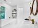 Spa-like bathroom with double vanity, soaking tub, and stylish fixtures with natural light at 3882 The Ascent Ne, Brookhaven, GA 30319