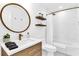 Elegant bathroom featuring modern fixtures, a sleek vanity, and a walk-in shower at 3882 The Ascent Ne, Brookhaven, GA 30319