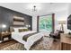 Inviting bedroom featuring modern decor, a large window, neutral colors and stylish rug at 3882 The Ascent Ne, Brookhaven, GA 30319