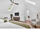 Spacious bedroom with vaulted ceilings, skylight, ceiling fan, and comfortable queen size beds at 3882 The Ascent Ne, Brookhaven, GA 30319