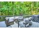 Relaxing outdoor deck featuring stylish seating, perfect for enjoying the serene wooded view at 3882 The Ascent Ne, Brookhaven, GA 30319