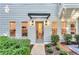 Charming home entrance featuring well-maintained landscaping and a welcoming covered doorway at 3882 The Ascent Ne, Brookhaven, GA 30319