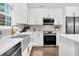 Well-equipped kitchen with updated appliances, sleek countertops, and bright lighting at 3882 The Ascent Ne, Brookhaven, GA 30319