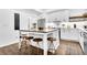 Bright open kitchen with a large island, stainless steel appliances, and wood grain flooring at 3882 The Ascent Ne, Brookhaven, GA 30319