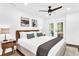 Serene primary bedroom featuring a ceiling fan, artwork, and access to an outdoor area at 3882 The Ascent Ne, Brookhaven, GA 30319