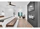 Relaxing main bedroom boasts fireplace feature, chandelier lighting, sitting area, and private balcony at 3882 The Ascent Ne, Brookhaven, GA 30319