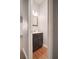 Stylish powder room with dark wood vanity and modern fixtures at 5381 Briar Creek Ln, Norcross, GA 30071