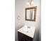 Stylish half bathroom with a modern vanity, mirror and new fixtures at 5381 Briar Creek Ln, Norcross, GA 30071