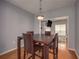 Dining room featuring a dining table, chairs and an open view to the living area at 5381 Briar Creek Ln, Norcross, GA 30071