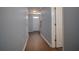 Inviting hallway with wood floors, fresh paint and a bright white front door at 5381 Briar Creek Ln, Norcross, GA 30071