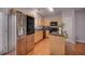 Spacious kitchen with stainless steel appliances, an island, and wood cabinetry at 5381 Briar Creek Ln, Norcross, GA 30071