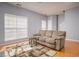 Comfortable living room with hardwood floors, large windows, and cozy seating at 5381 Briar Creek Ln, Norcross, GA 30071