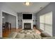 Inviting living room with fireplace, TV, hardwood floors, and ample natural light at 5381 Briar Creek Ln, Norcross, GA 30071