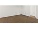 Neutral colored carpeted basement with white trim and white walls is ready to be finished at 305 Bridgewater Ter, Canton, GA 30115