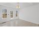 Sunlit dining area with access to the deck, perfect for indoor-outdoor living at 305 Bridgewater Ter, Canton, GA 30115