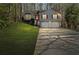 Charming two-story home with a two-car garage and a well-manicured lawn at 305 Bridgewater Ter, Canton, GA 30115