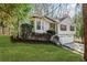Charming two-story home featuring a bay window and large, shady front yard at 305 Bridgewater Ter, Canton, GA 30115