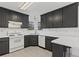 Stylish kitchen featuring grey cabinets, white countertops, and a bright, airy atmosphere at 305 Bridgewater Ter, Canton, GA 30115