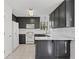 Modern kitchen featuring grey cabinets, white countertops, and ample natural light at 305 Bridgewater Ter, Canton, GA 30115