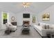 Bright living room with fireplace, vaulted ceilings, and neutral decor at 305 Bridgewater Ter, Canton, GA 30115