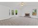 Spacious living room with vaulted ceiling, fireplace, and large windows showcasing natural light at 305 Bridgewater Ter, Canton, GA 30115