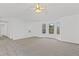 Inviting living room with large windows, vaulted ceilings, and bright neutral decor at 305 Bridgewater Ter, Canton, GA 30115