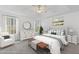 Comfortable main bedroom with tray ceiling, lots of light, and neutral decor at 305 Bridgewater Ter, Canton, GA 30115