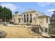 Expansive backyard featuring a stone patio with seating, offering a perfect space for outdoor enjoyment at 4040 Annecy Dr, Atlanta, GA 30331