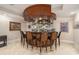 An elegant and well-stocked home bar with pendant lights and seating for six at 4040 Annecy Dr, Atlanta, GA 30331