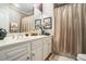 Elegant bathroom vanity with white cabinets and decorative fixtures at 4040 Annecy Dr, Atlanta, GA 30331