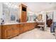 A stylish bathroom boasts custom wood cabinets, a vanity, and decorative mirrors, adding to its luxurious appeal at 4040 Annecy Dr, Atlanta, GA 30331