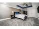 A spacious bedroom with a tray ceiling, a ceiling fan, and carpet flooring at 4040 Annecy Dr, Atlanta, GA 30331